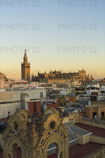 Spain, Seville, Cityscape with Cathedral of Seville at sunset