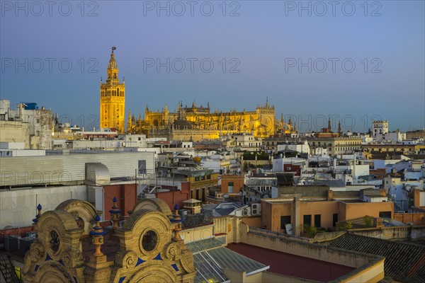 Spain, Seville, Cityscape with Cathedral of Seville at sunset