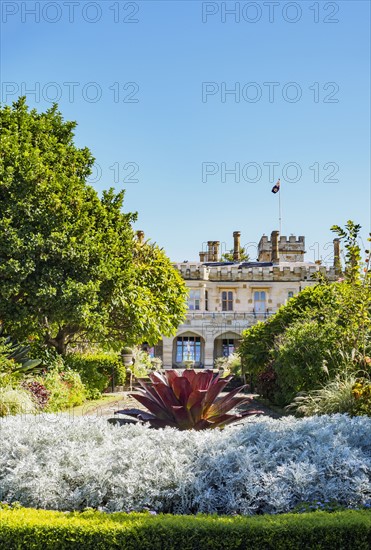 Australia, New South Wales, Sydney, Ornamental garden with building in background