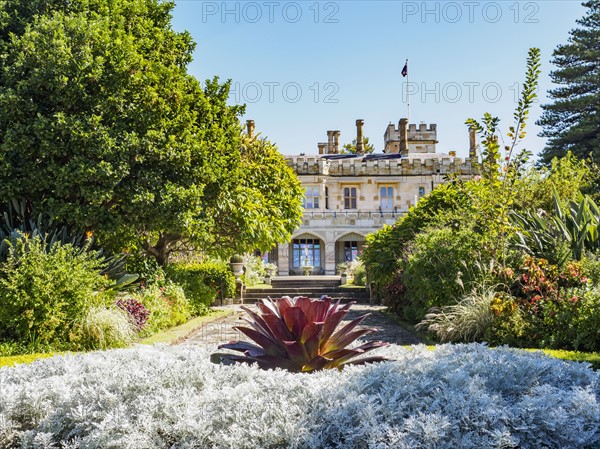 Australia, New South Wales, Sydney, Ornamental garden with building in background