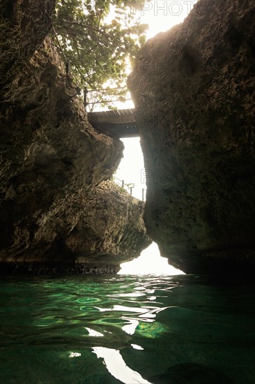 Jamaica, Negril, Footbridge hanging between rocks