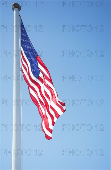 American Flag flying against clear sky