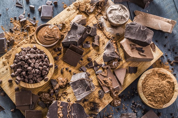 Various chocolate pieces on cutting board