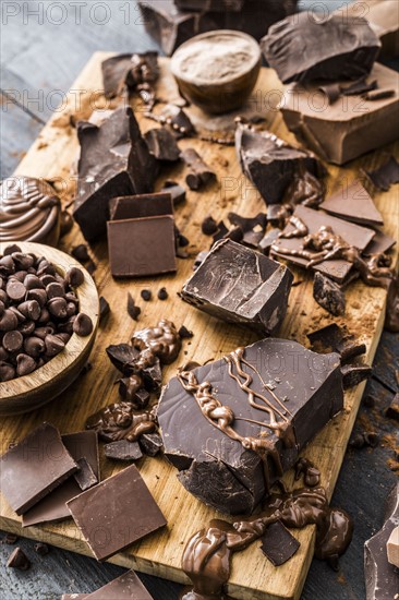 Various chocolate pieces on cutting board