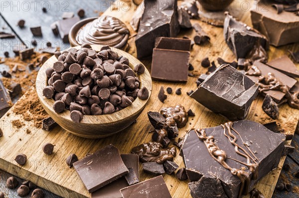 Various chocolate pieces on cutting board