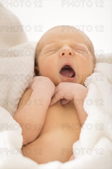 Newborn boy (0-1 month) yawning