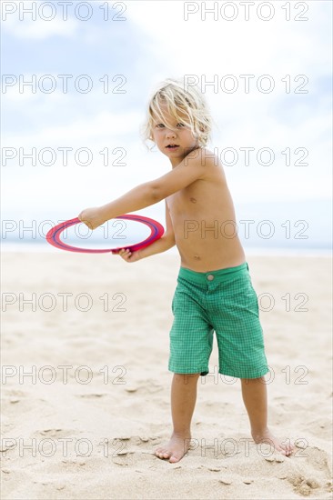 Boy (4-5) playing with plastic ring