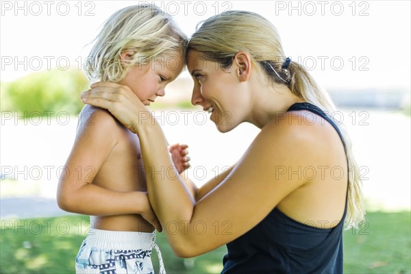 Mother with son (4-5) embracing