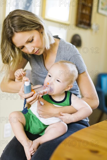 Mother inhaling son (12-17 months)