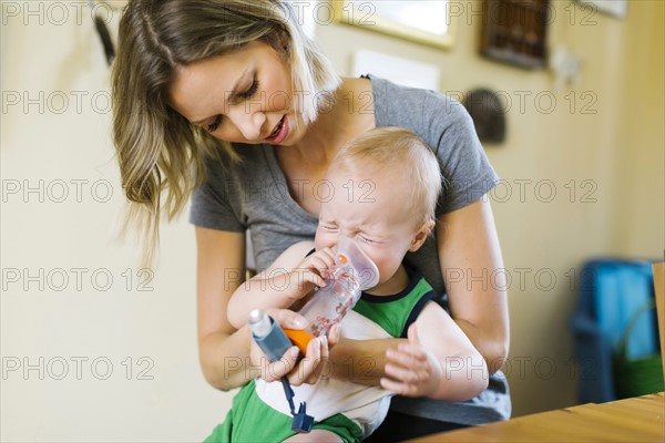 Mother inhaling son (12-17 months)