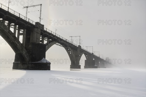 Ukraine, Dnepropetrovsk region, Dnepropetrovsk city, Bridge over frozen river