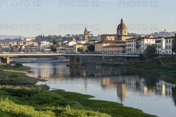 Italy, Tuscany, Florence, Cityscape reflected in Arno river