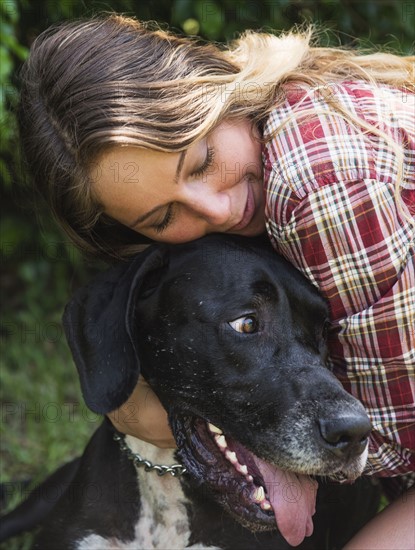 Woman hugging Great Dane