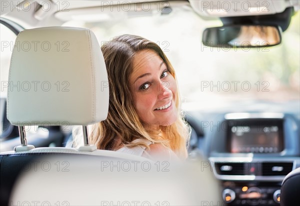 Portrait of woman in modern car