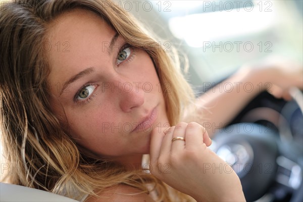 Portrait of woman in car driving