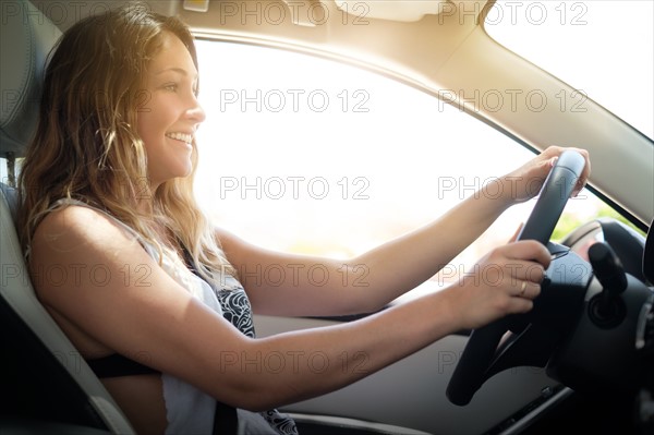 Happy woman driving
