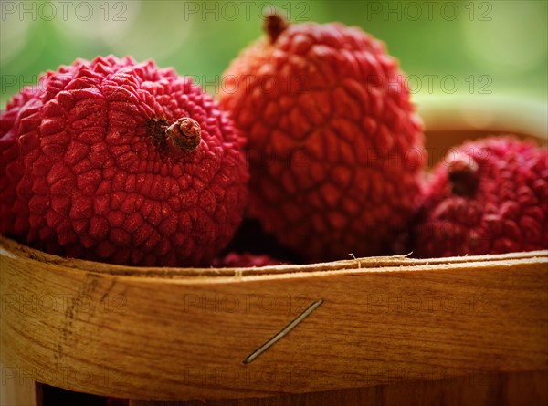 Red lychee in basket