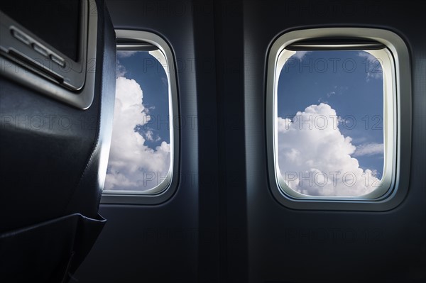 Clouds behind airplane window