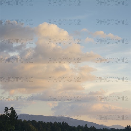 USA, New York, North Elba, Lake Placid, Clouds above mountains at dusk