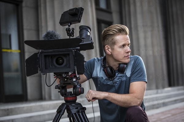 Portrait of camera operator looking away