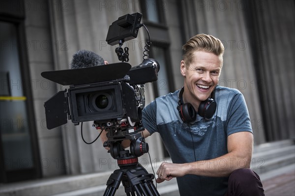 Portrait of smiling camera operator