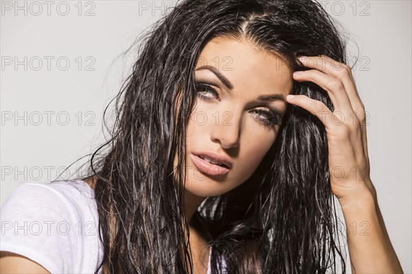 Portrait of woman with wet hair, looking away