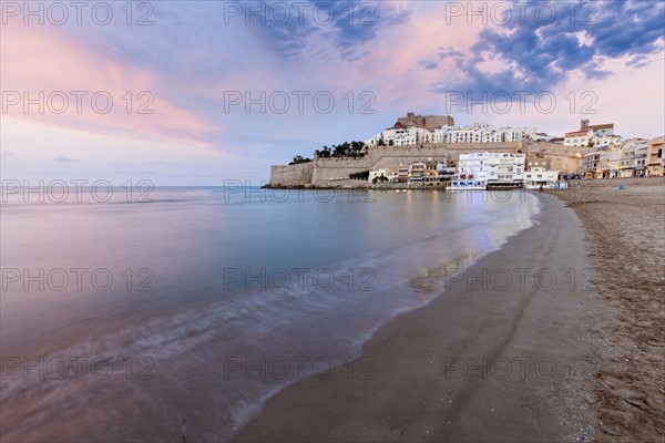 Spain, Valencian Community, Peniscola, Waterfront town at sunset