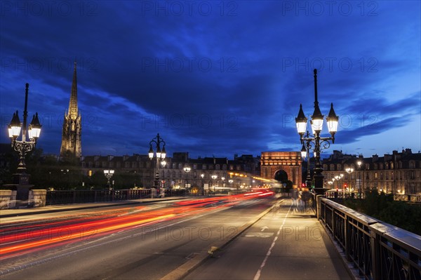 France, Nouvelle-Aquitaine, Bordeaux, Cailhau Gate, Incidental people and cars in long exposure