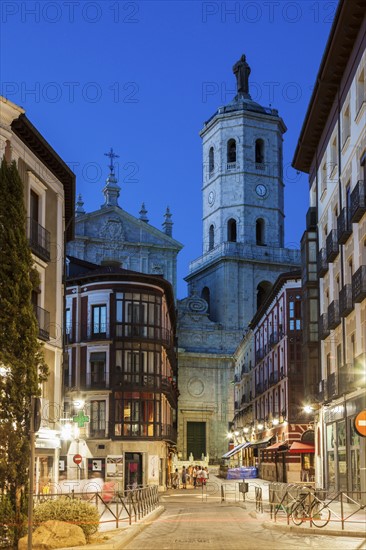 Spain, Castile and Leon, Valladolid, City street with Cathedral of Valladolid in background