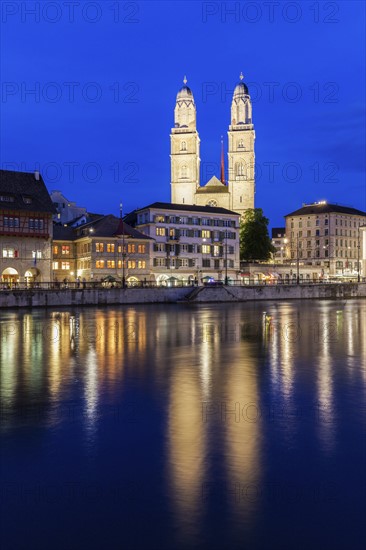 Switzerland, Zurich, Grossmunster Church and Limmat River at night