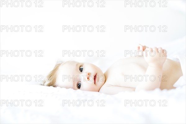 Portrait of baby girl (6-11 Months) looking at camera