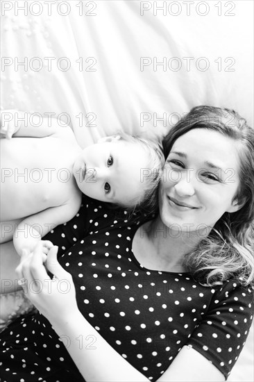 Portrait of baby girl (6-11 Months) with mother, directly above