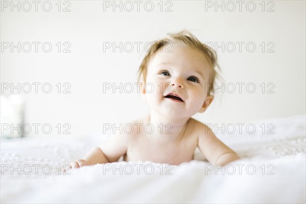 Baby girl (6-11 months) playing in bedroom