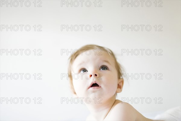 Baby girl (6-11 months) playing in bedroom