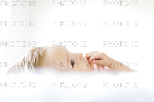 Baby girl (6-11 months) playing in bedroom