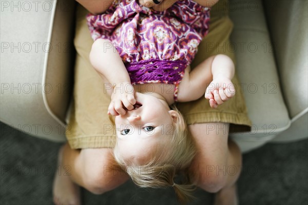 Father playing with baby girl (12-17 months)