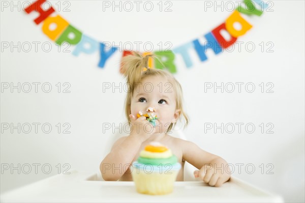 Baby girl (12-17 months) celebrating first birthday