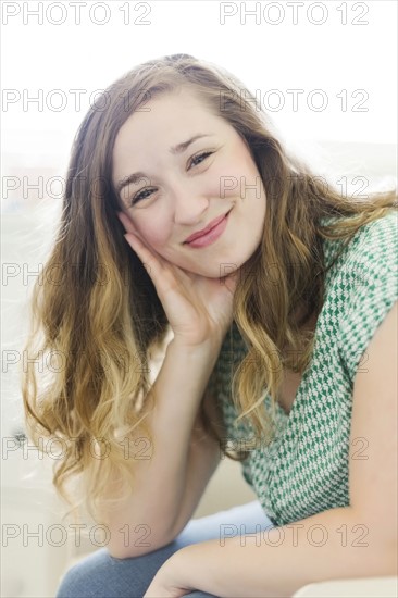 Portrait of woman sitting in living room