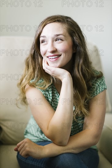 Portrait of woman sitting in living room