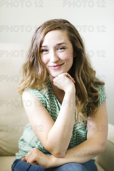 Portrait of woman sitting in living room