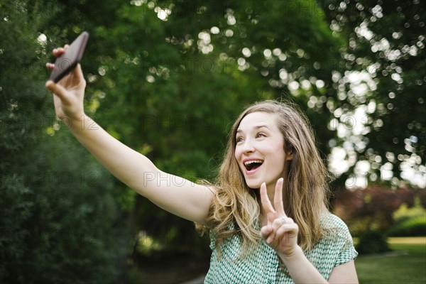 Beautiful woman taking selfie