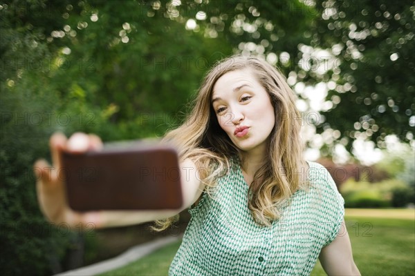 Beautiful woman taking selfie