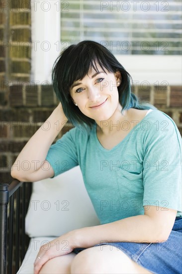 Portrait of smiling woman on porch