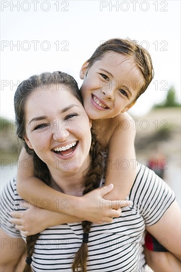 Portrait of smiling mother with son (6-7)