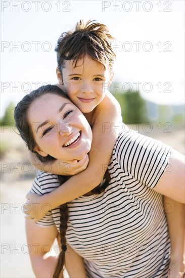 Portrait of smiling mother with son (6-7)