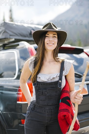 Outdoor portrait of smiling woman wearing hat