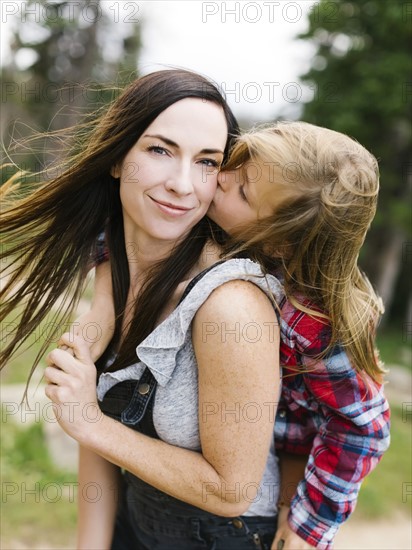 Boy (6-7) kissing his mother