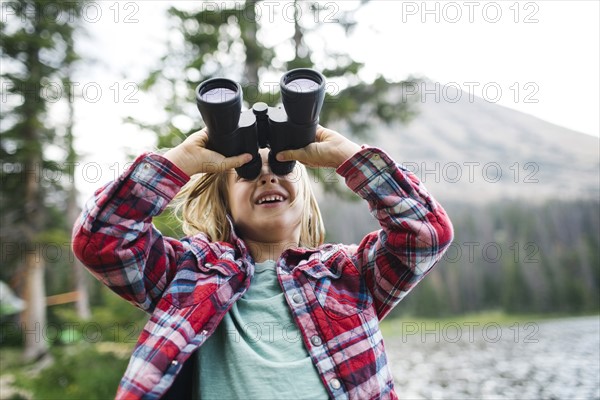 USA, Utah, Midway, Portrait of boy (6-7) looking through binoculars