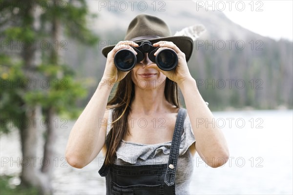 Woman using binoculars