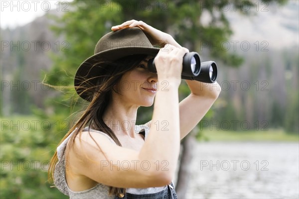 Woman using binoculars